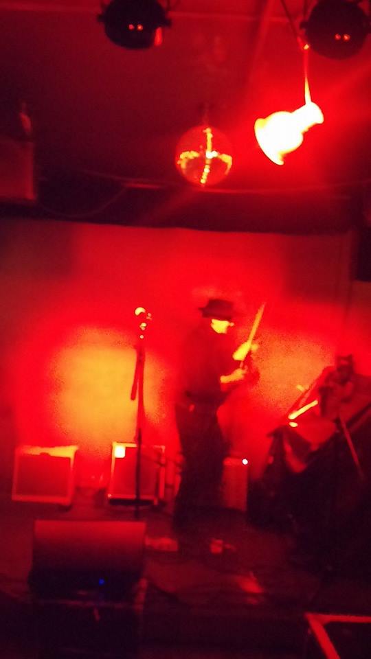 Walter performing in red light